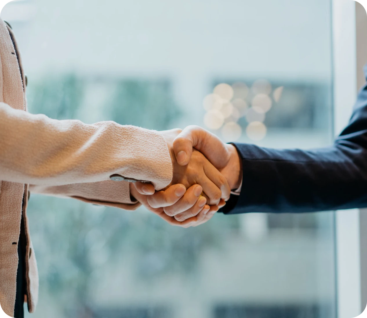 Business handshake in office setting