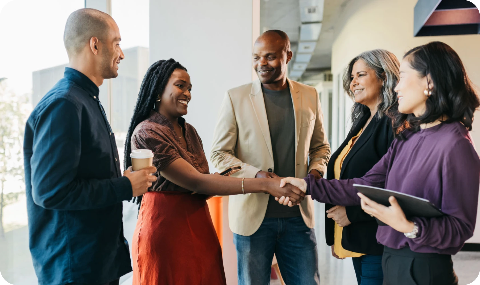Professionals shaking hands during conversation