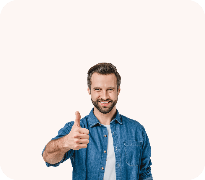 Smiling man showing thumbs up gesture